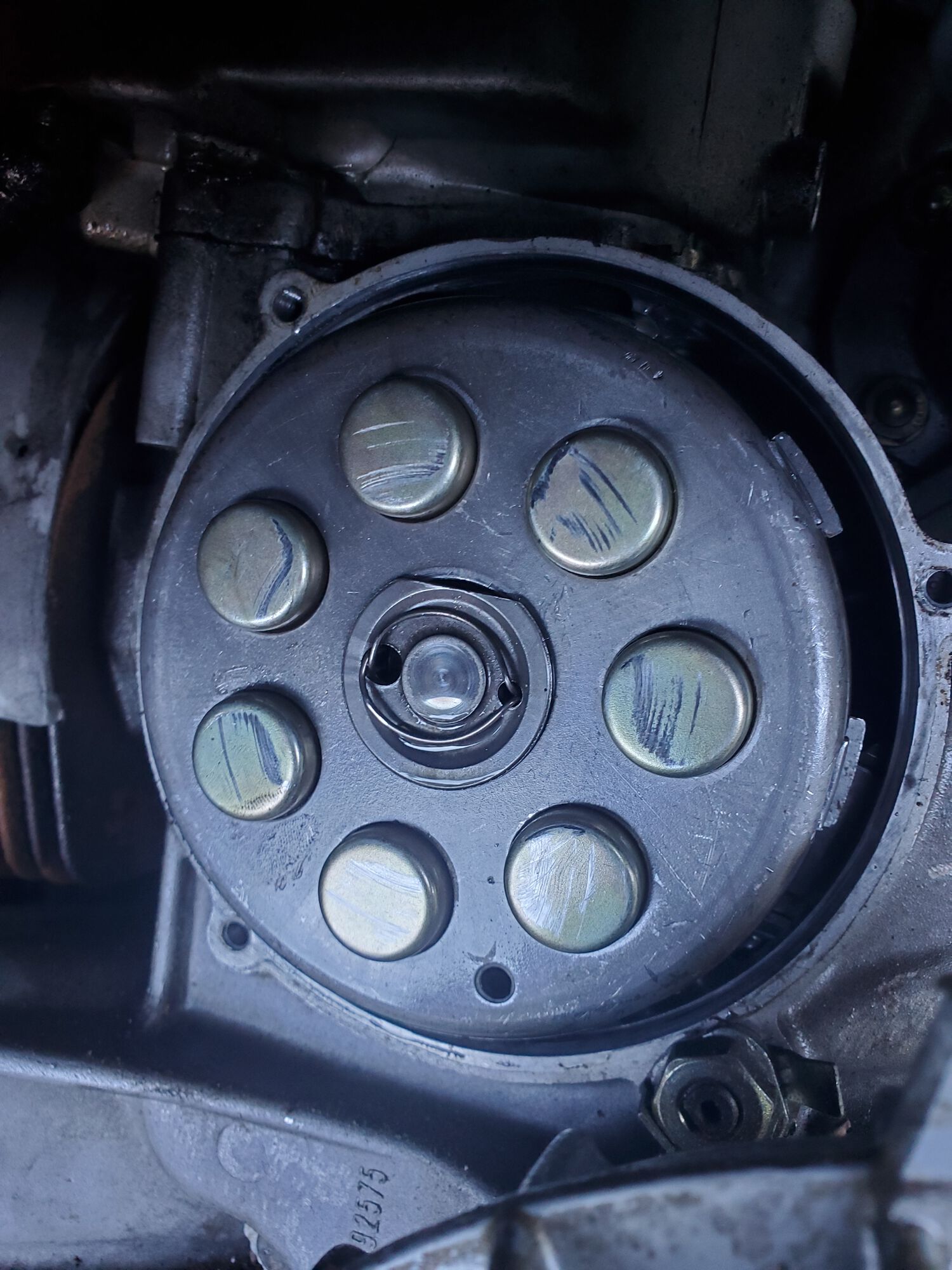 I saw that the spring cups had been fouling on I think guess the clutch cover. The scratches in reality are very light and only some barely catch a fingernail