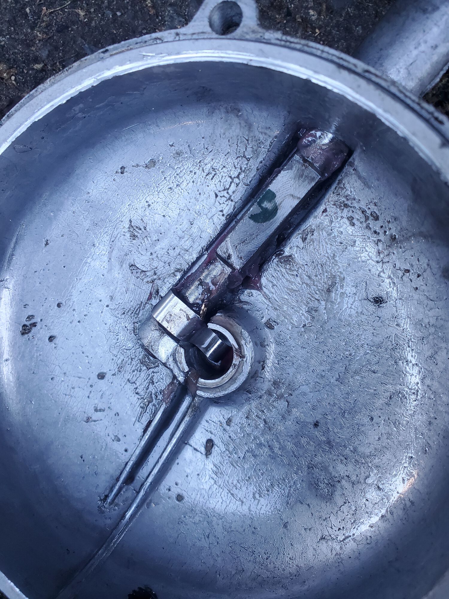 On close inspection of the cover, I see no where the spring cups have been making contact though. I checked the milled portion of the shaft and no dings. I think the clutch disk tabs may have contacted the outer rim of the cover.