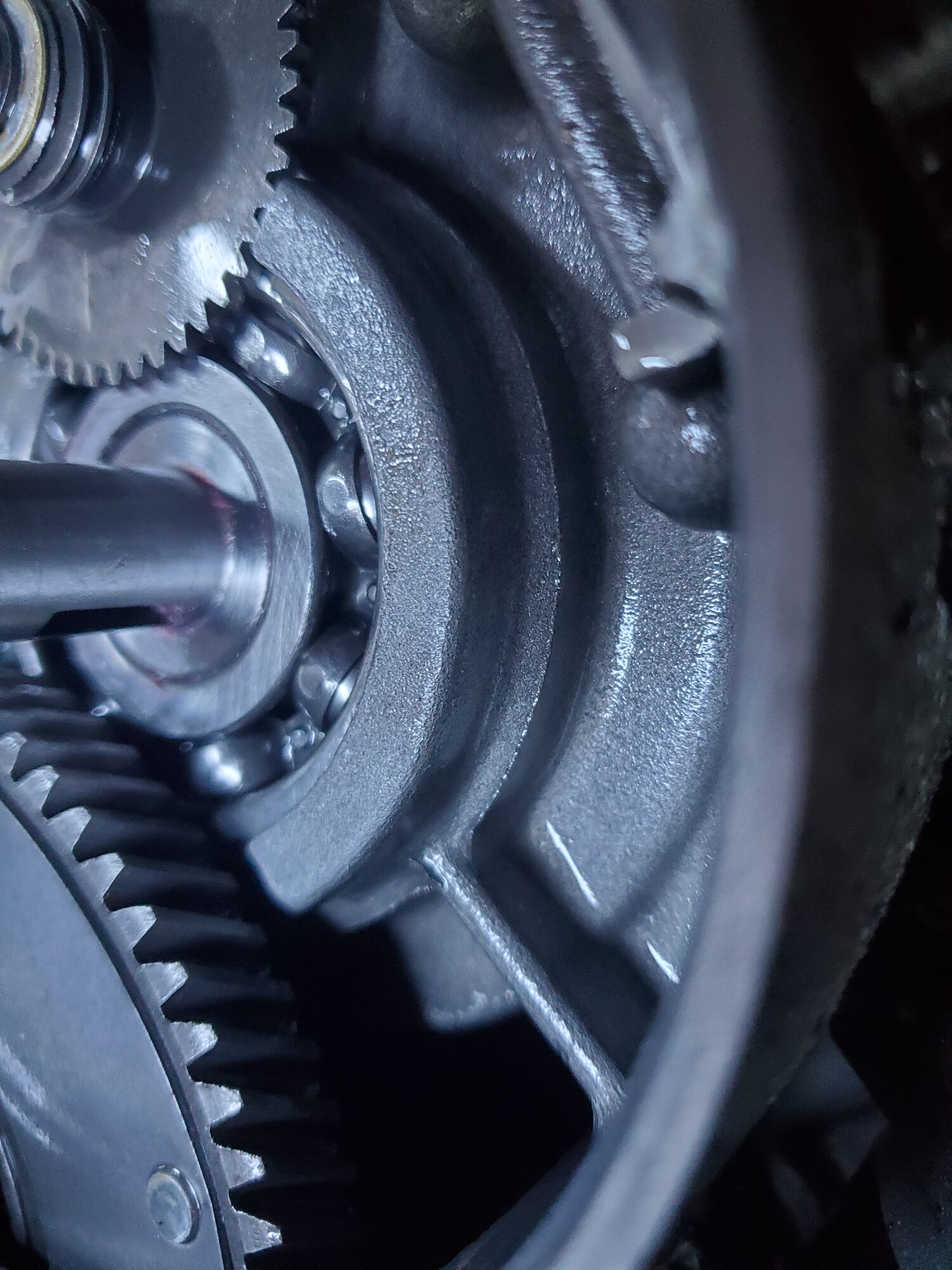 The crank sits slightly recessed in the inner race i.e. the race is proud of the flat portion of the crank. It was .5 mm lower than the race which matches Moped Freaks measurement in one of his videos