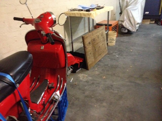 The side of the garage that ends up being scooter central