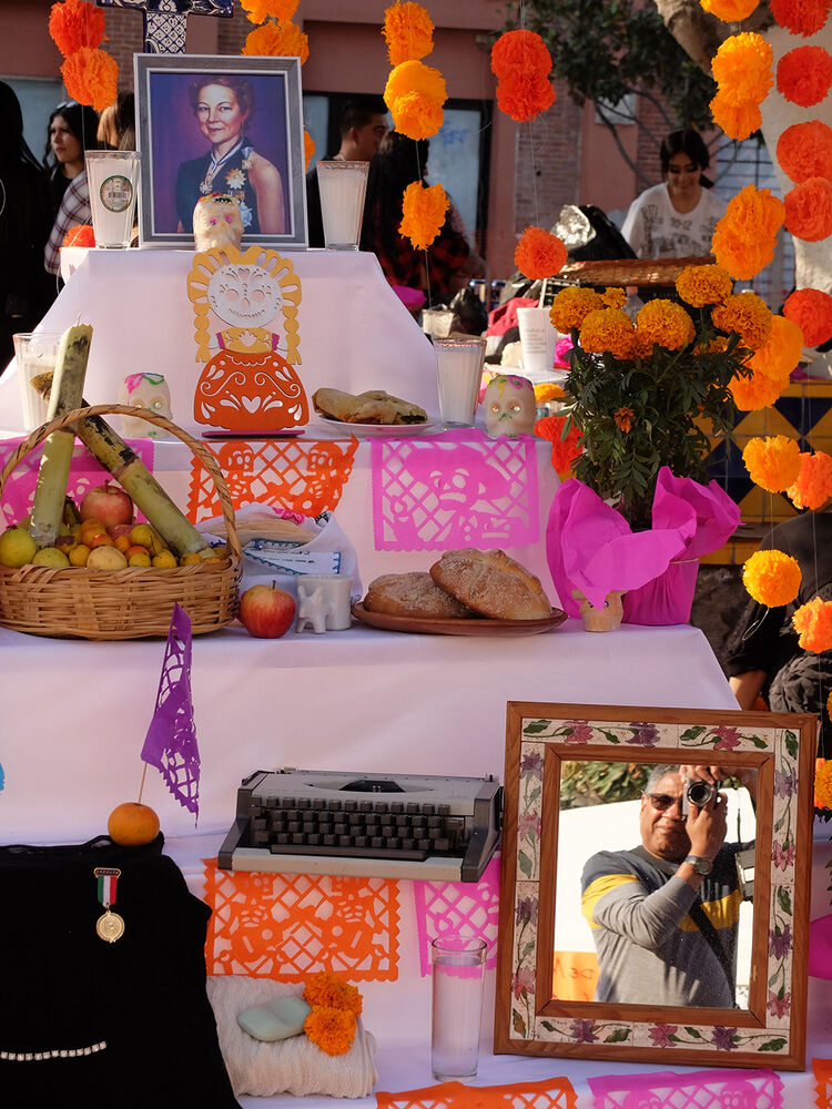 Shrine with Self-Portrait: A centerpiece of the celebration are the shrines to the departed; many of them include a mirror, which is a subtle way of saying "someday this could be you."