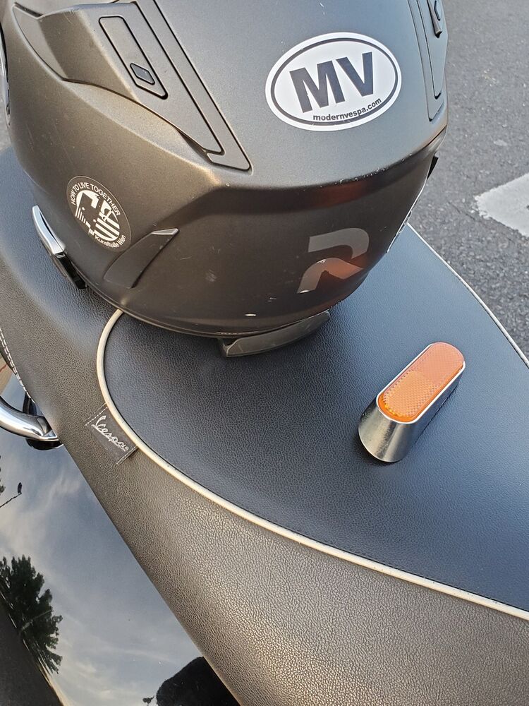 Had a hard time finding a picture of the old helmet w/sticker: here 'tis.