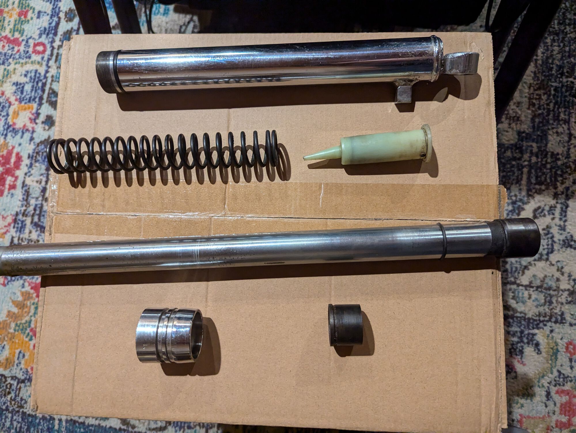 Front fork leg, cleaned and disassembled.