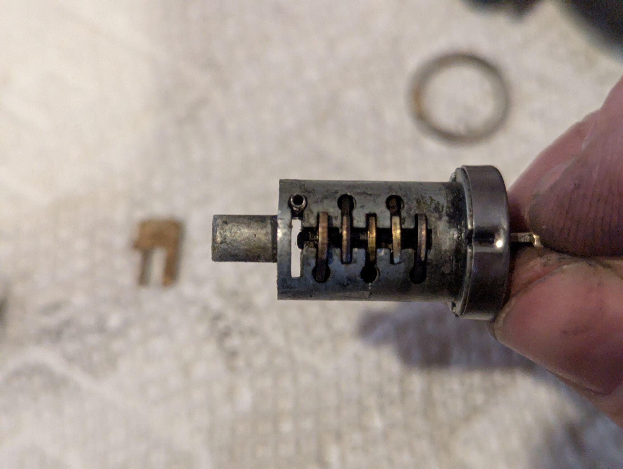 Last key-pin is open at the bottom and has a notch at the top. In order to actuate it, you want to insert the key all the way in, then pull it back one notch.