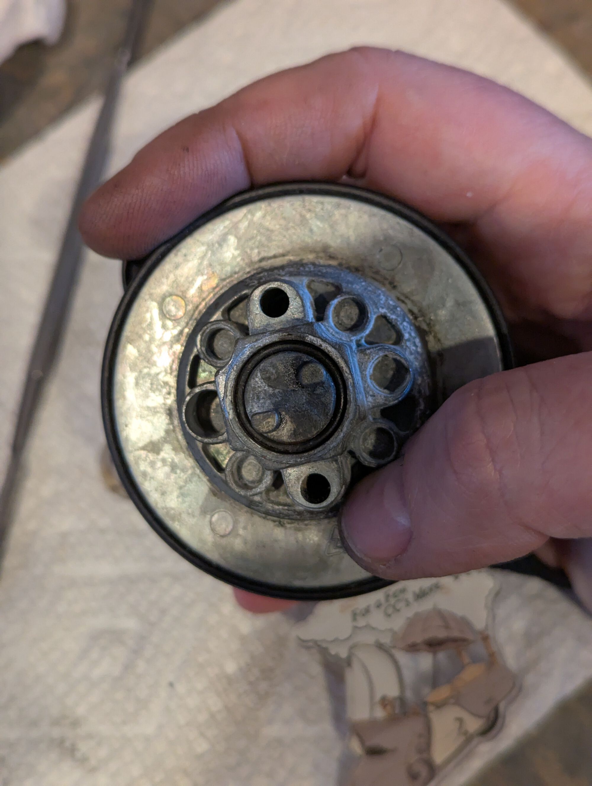 The actuator that pulls the locking tabs in is held in with an O-ring. You may just be able to grab on of the tabs with a pair of pliers and wiggle it out, but an O-ring installation tool may be needed if things are crusty/stuck.