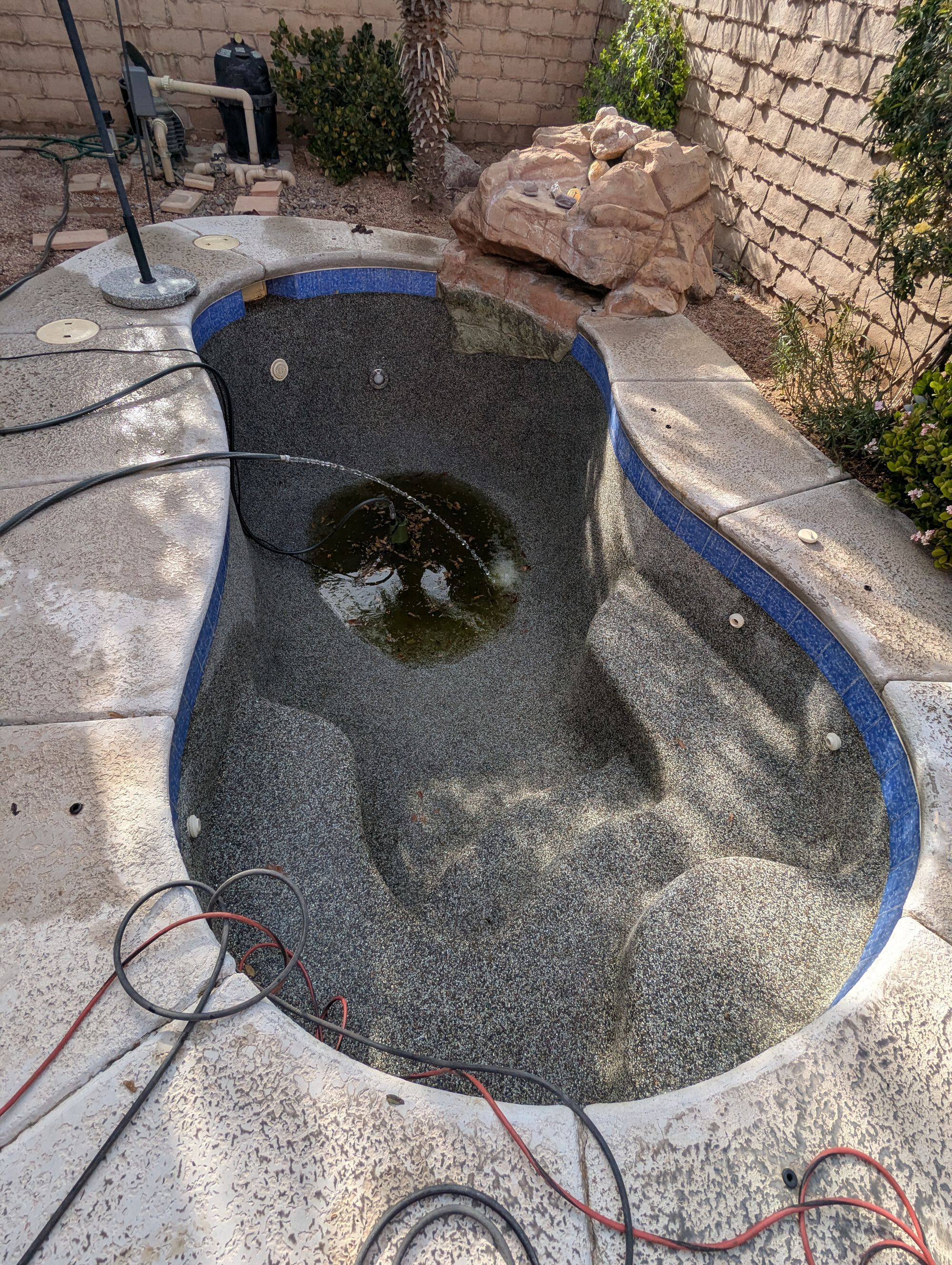 Pebble Tec cleaned. Just pumping out the ick water so I can finish it with the shop vac.