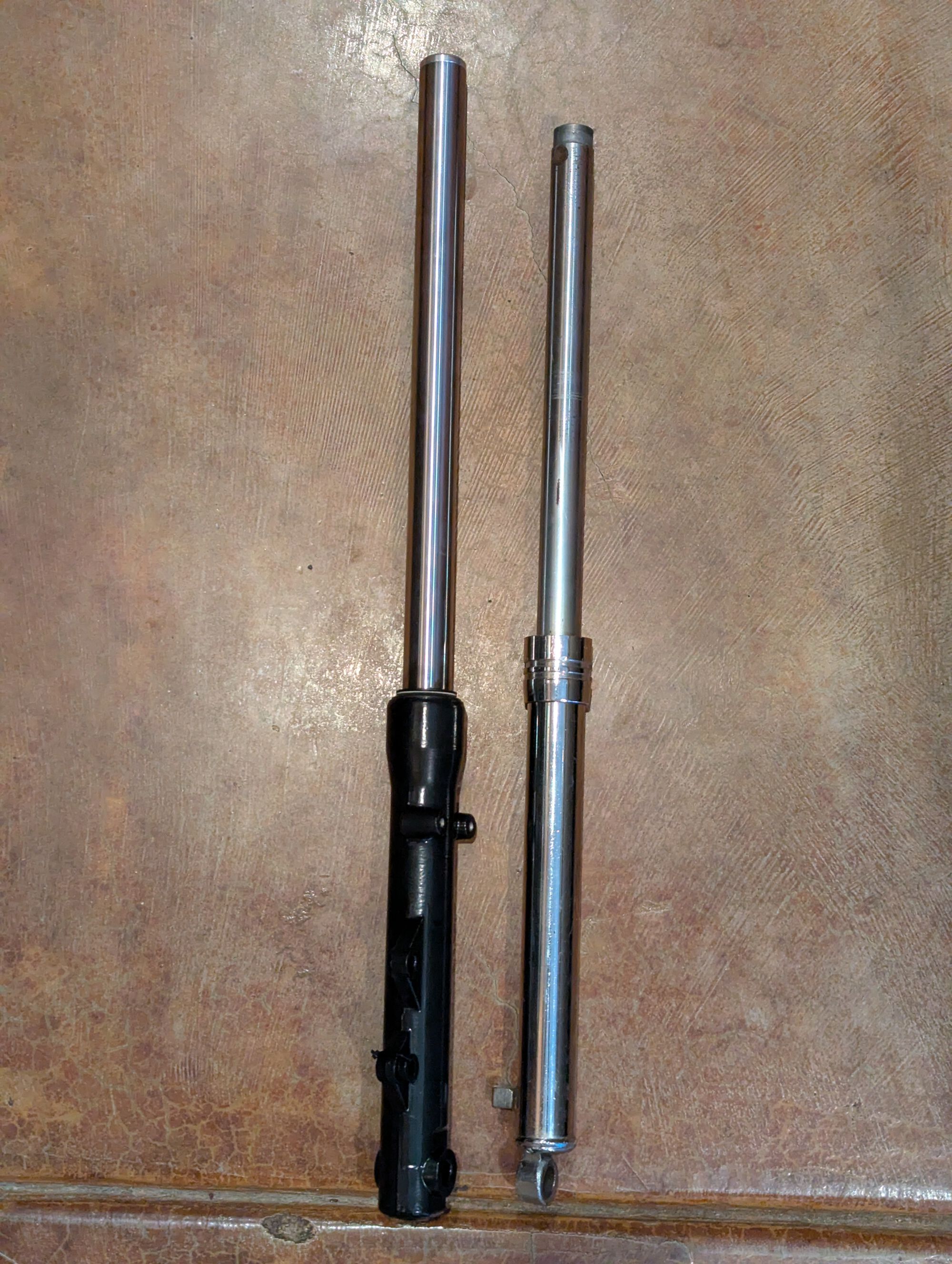Fork length increases by ~50mm. Fork diameter increases from 27mm to 30mm. Forks are hydraulic now and have fitments for a fork brace and a disc brake.