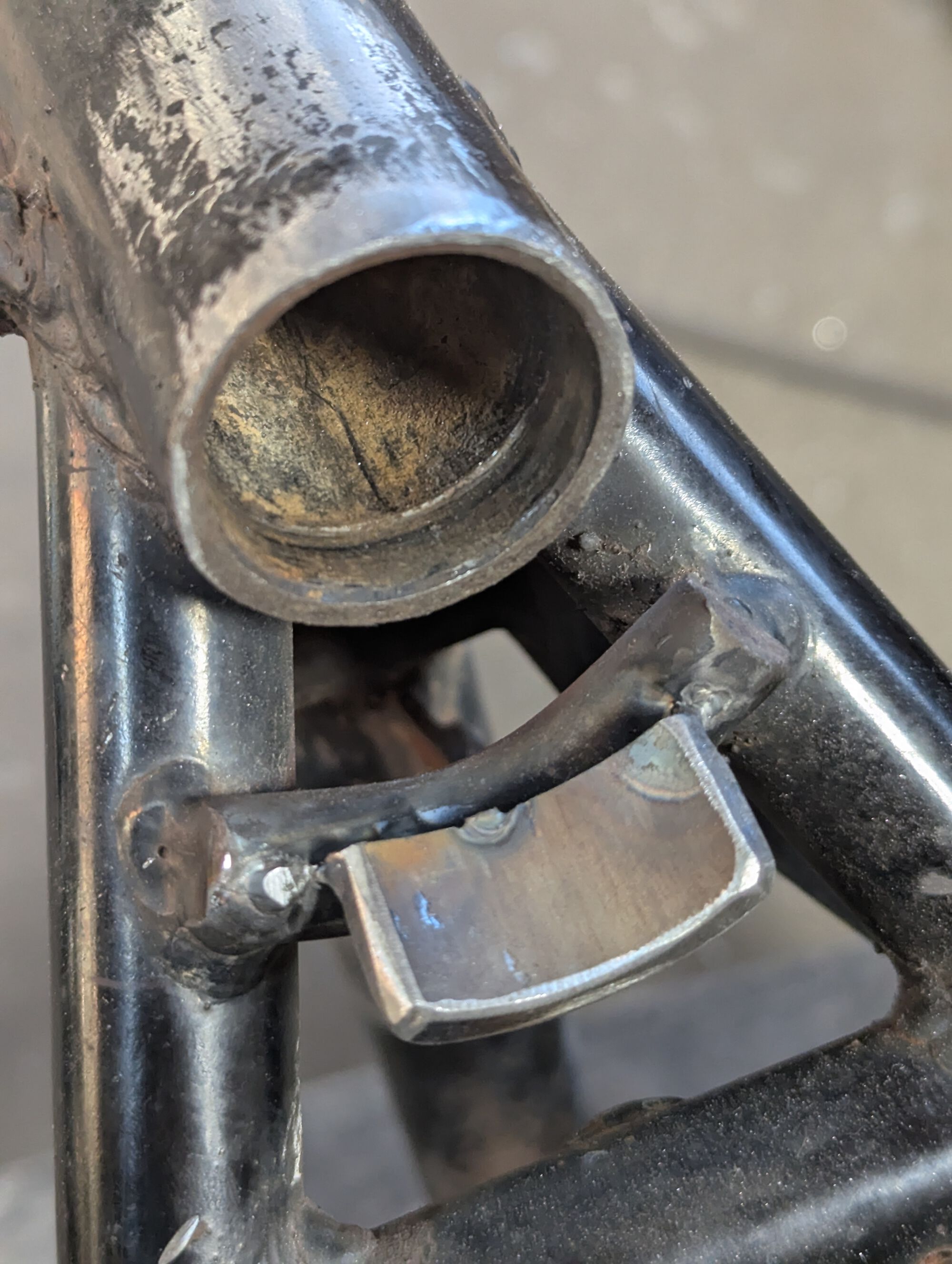 Modified steering stop. Tacked to  figure out angles, but it's now fully welded.