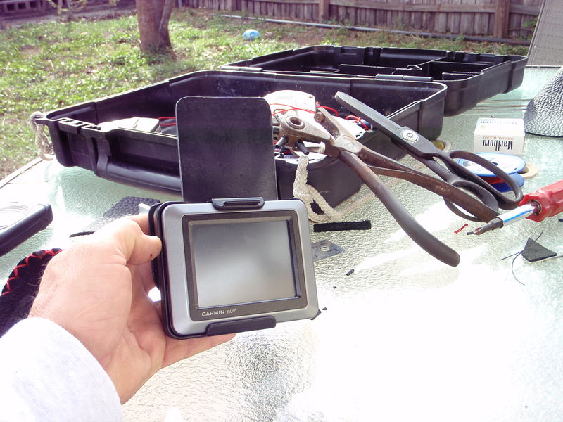 I started with a piece of black plastic that the neighbor was getting rid of. And here we go. I placed it behind the ram mount for the GPS. The plastic was 3/32 thick. Just enough for the nylocks to engage.