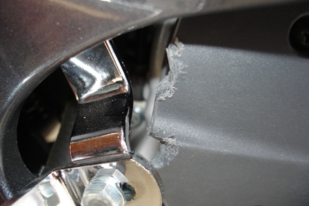 Close up of the damage to the plastic intake cover