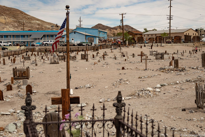 Looking back toward the Clown Motel, across the cemetery.  The old, tattered flag flapped in the light breeze.