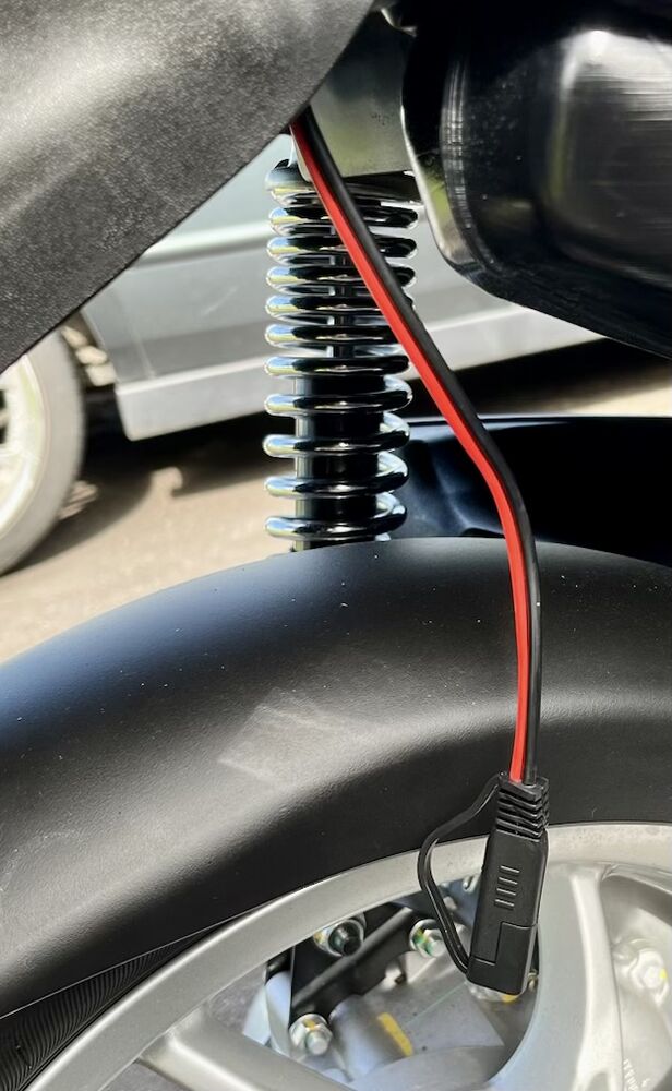 red and black wire tap hanging down from right-side under the seat