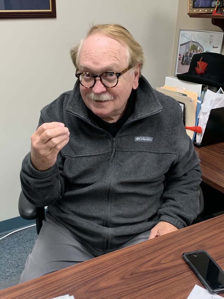 In the office, selling "Stupid Insurance" to nice people everyday.