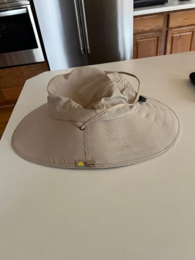 Lite weight with chin strap to prevent blowing off.