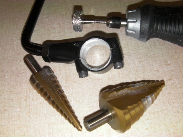 I used some harborfreight step bits for rough opening and a diamond grinding wheel for shaving down the mounts.