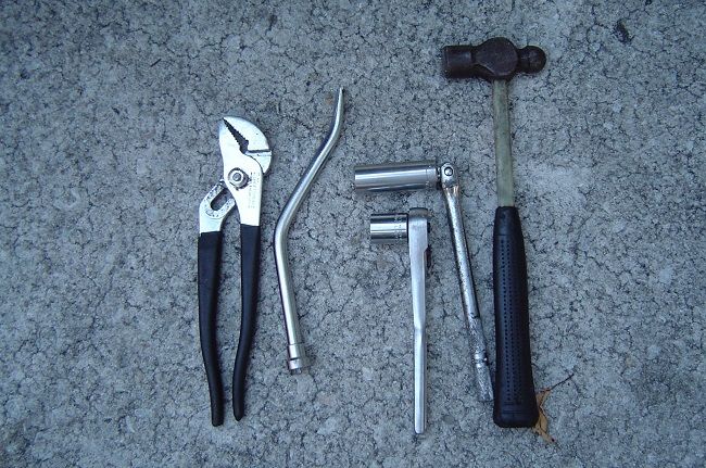These are the tools I used. I have a break spring tool that was great for removing the spring, but it's useless for putting it on. You have to hook up the spring before installing the bolt.