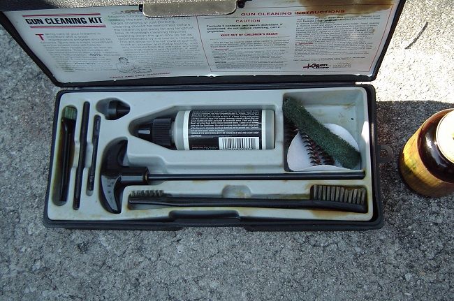 I used my gun cleaning kit to clean out the hole the bushing fit's into. My 40 cal. brush was small but it did the job. A shotgun brush or a bottle brush should do a better job. The cleaning pads worked nicely.