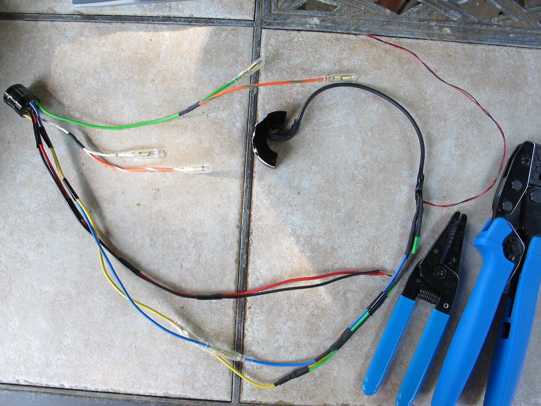 3rd time re-doing the connections, used the better vintageconnections connectors and spliced directly to wires this time. Leaves more room inside handlebar to accomodate the brake light switch spring setup.