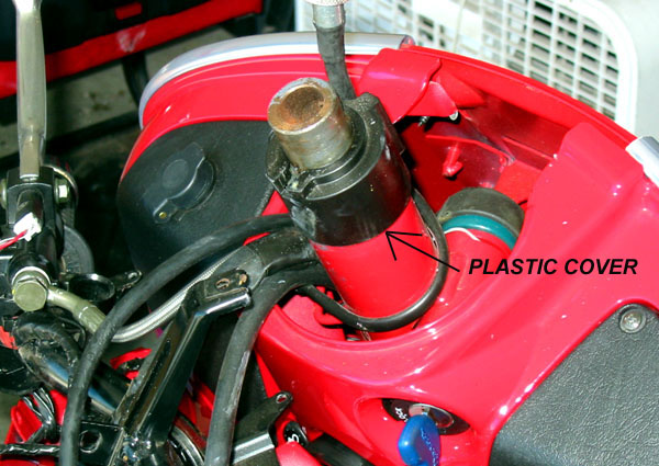 Handlebars removed, showing black plastic cover
