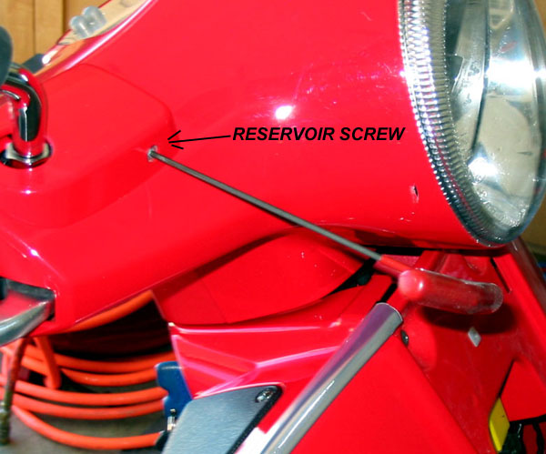 Removing brake reservoir screws