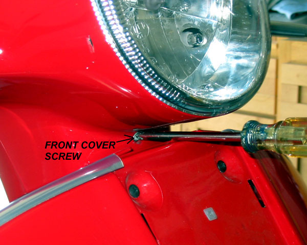 Removing one of three screws in front cover