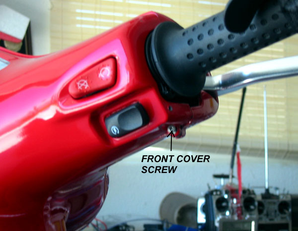 Removing screws at each end of front cover