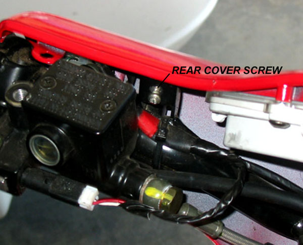 One of four screws to be removed