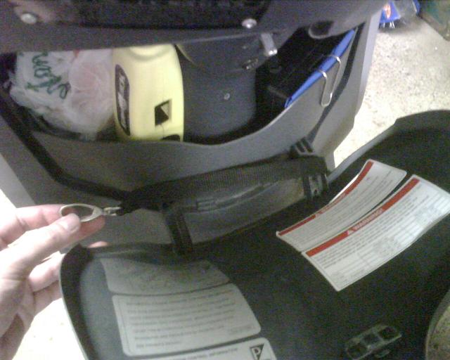 This is how I 'install' the strap.  Simply open the glovebox, lay the strap on then close.