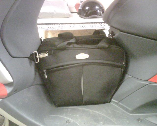 Here you can see how the anchor points attach to my homemade D rings.  The bag hook under the seat holds the handles of the bag and the whole thing is quite secure.  Mission accomplished for $20.