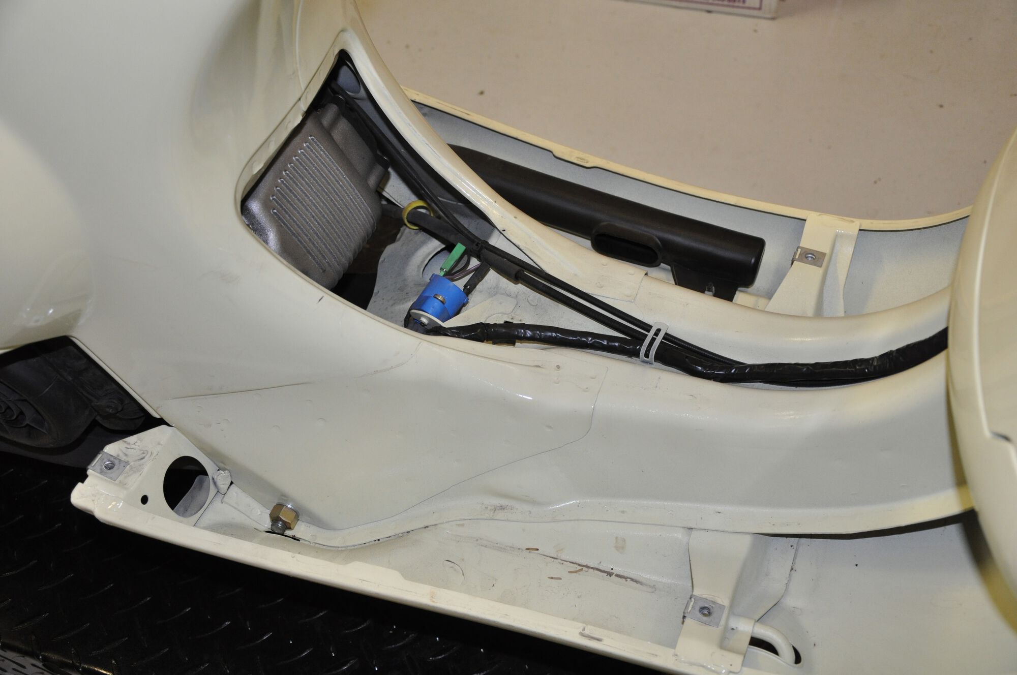 Remembering what the routing of the wiring harness and throttle cables looked like...