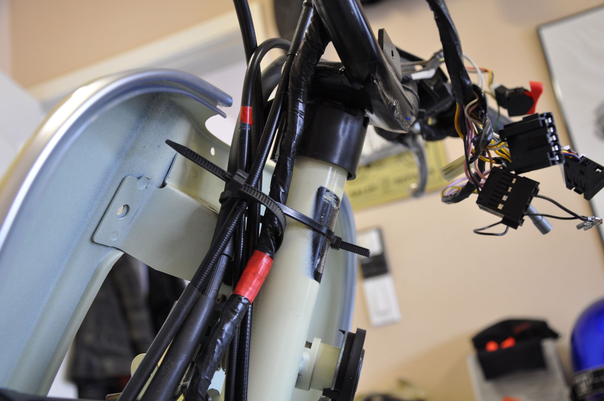 I've taken [b][i]lots[/i][/b] of shots of the wiring harness so I can get it all routed back the same way.  This is just one example.  I'm always interested in where there are zip-ties holding things in place.