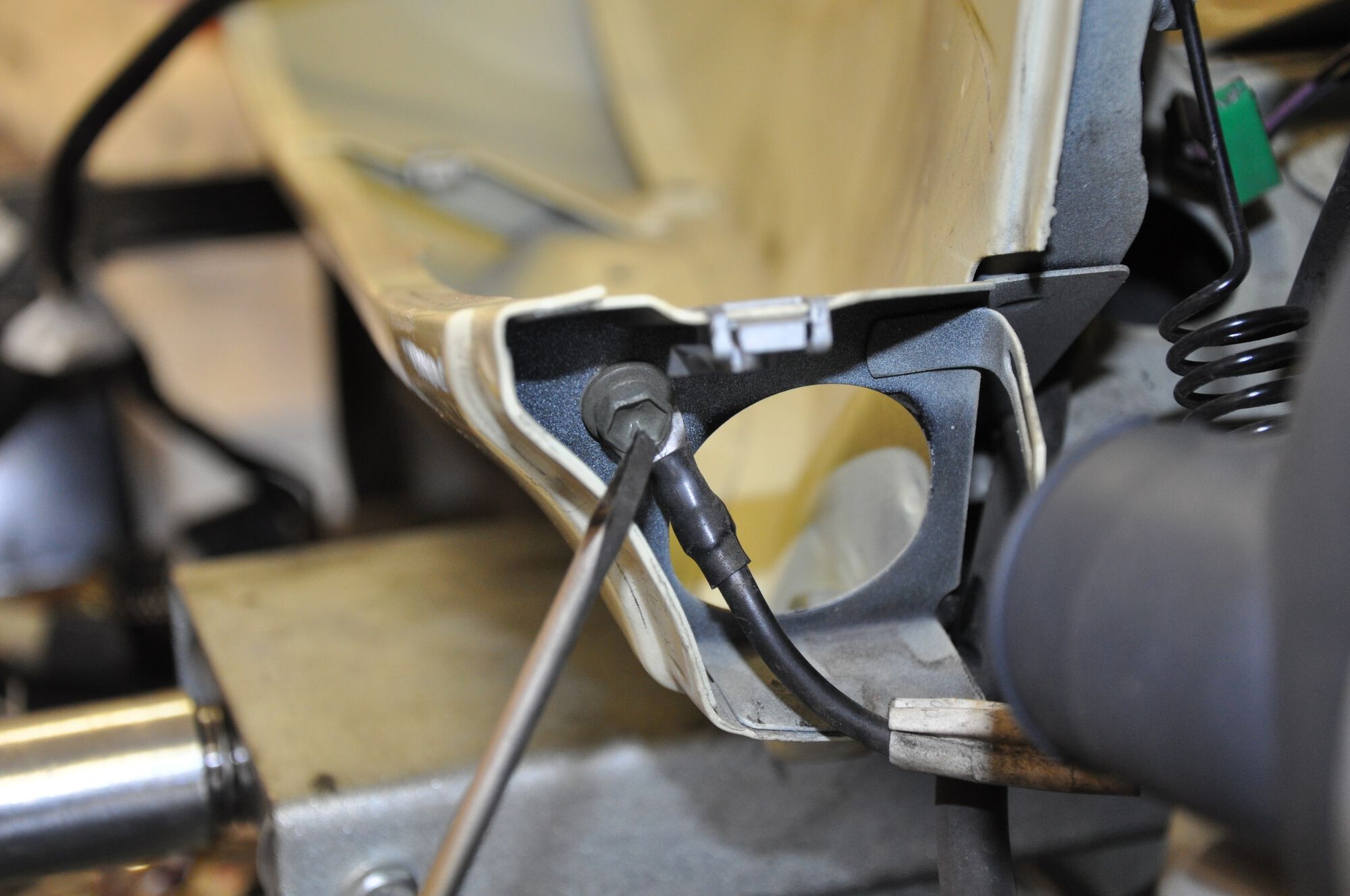 Ground strap between the engine and the frame.