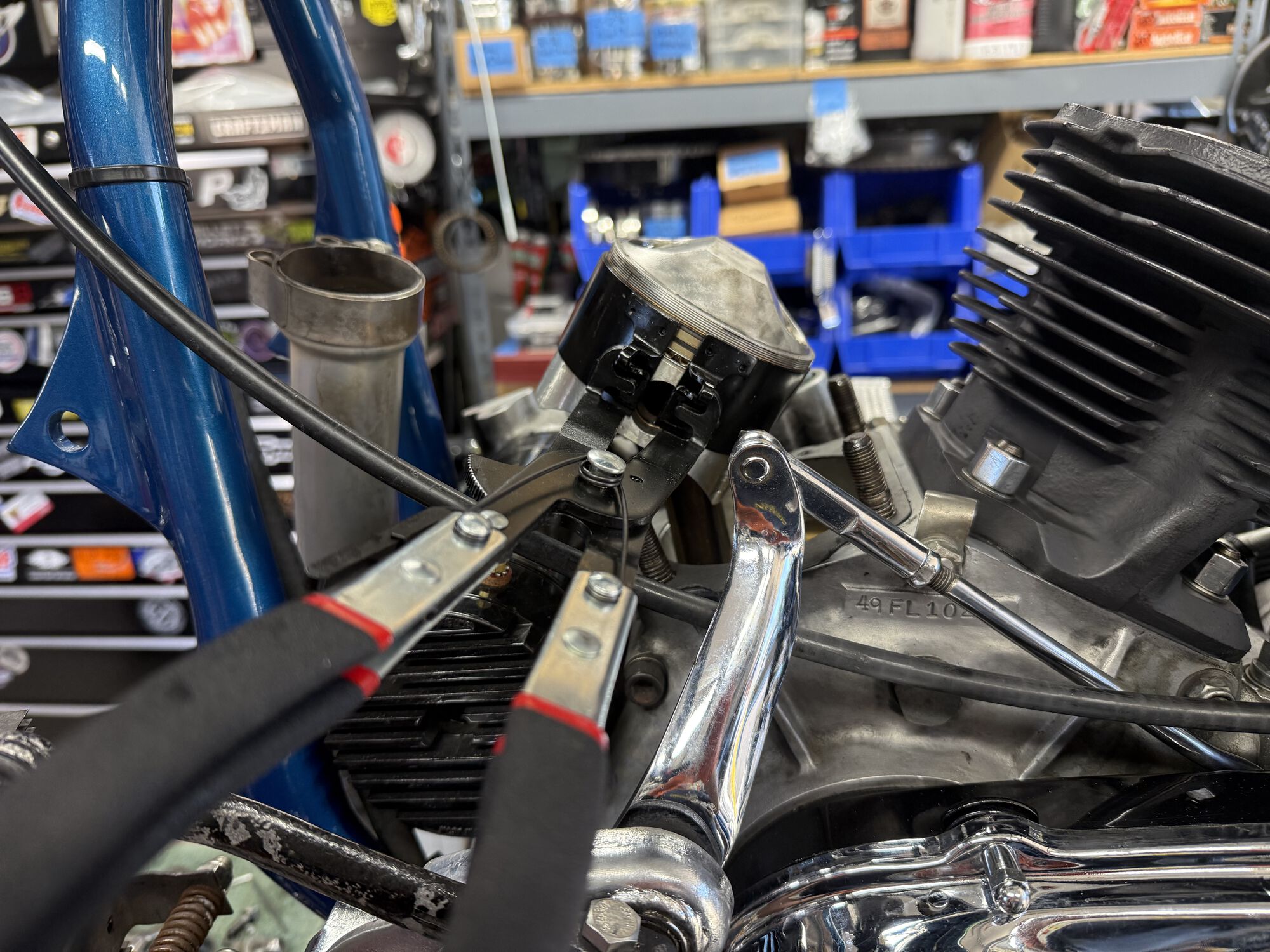Rear cylinder and piston are already installed. This is the ring compressor used to allow the cylinder to slip easily over the piston and rings.