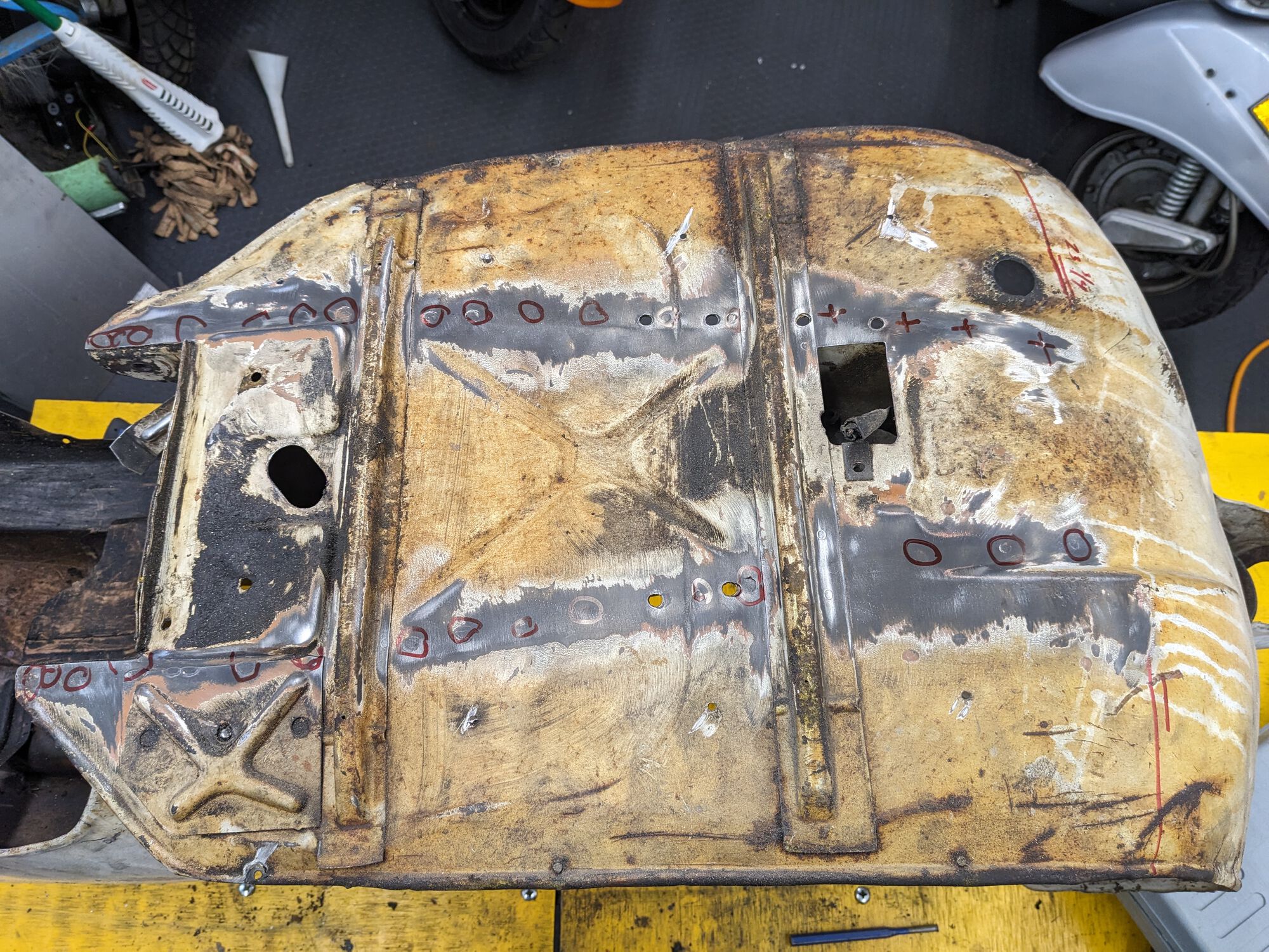 before.  Plug welds marked for drilling.