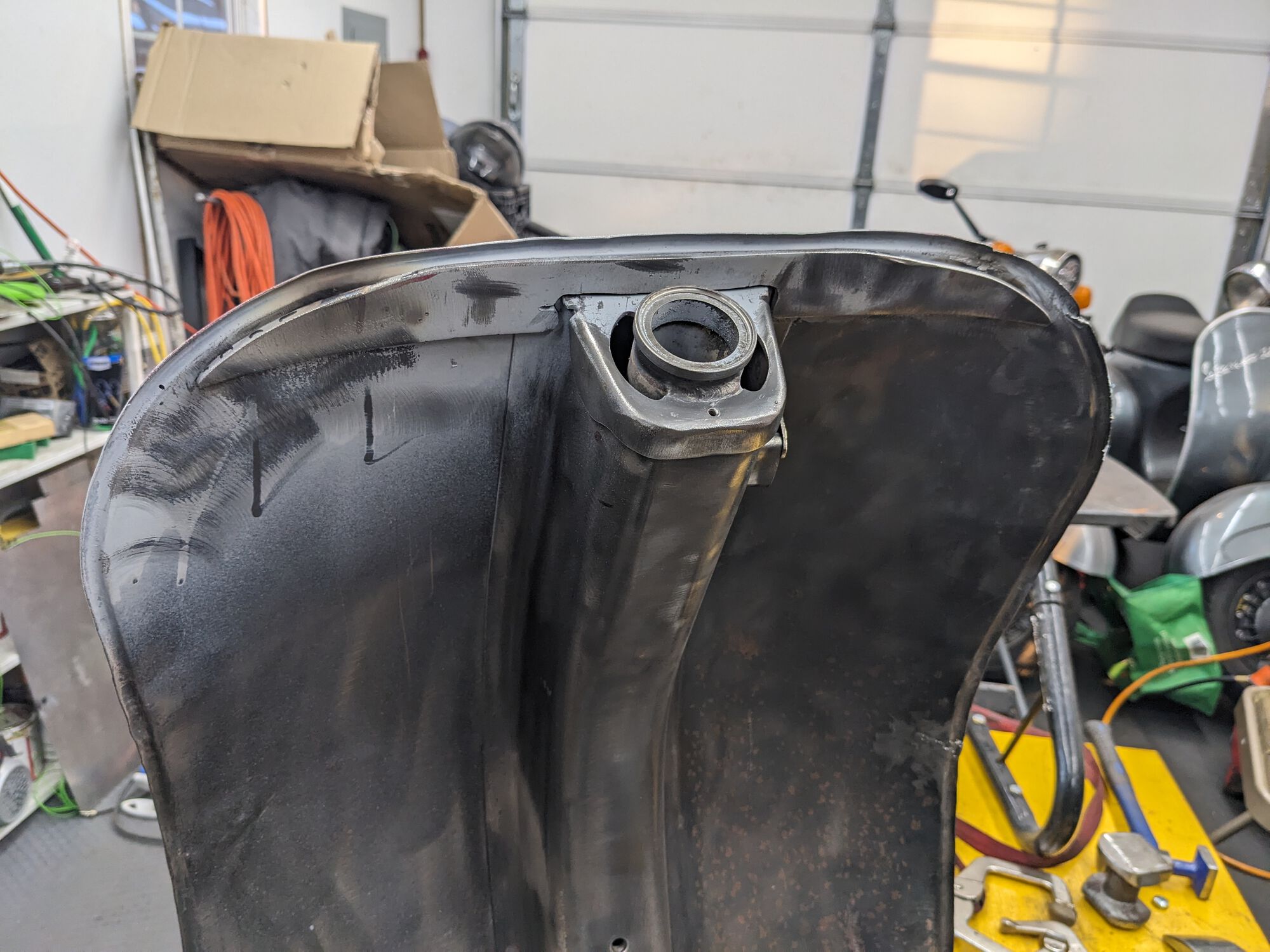 The frame is straight, but the legshield isn't quite centered.  I'd have assumed they used a jig for that, but maybe not.