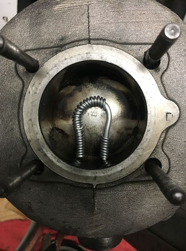 $20 of solder - I flipped it over and shaped it better to fit snug to edge of cyl - then taped it in place - before I turned over the motor.