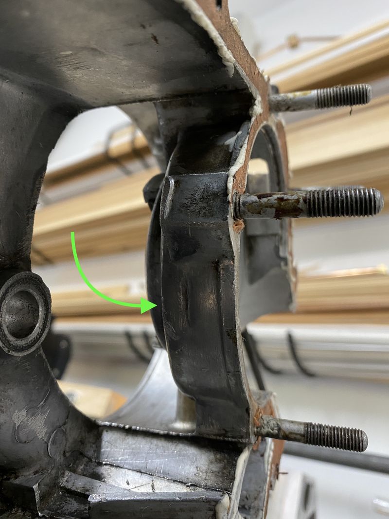 This "cup" that holds the crank on the clutch side, has a small tapered area.  This is the thinnest area that would be affected by adding a groove to the cases