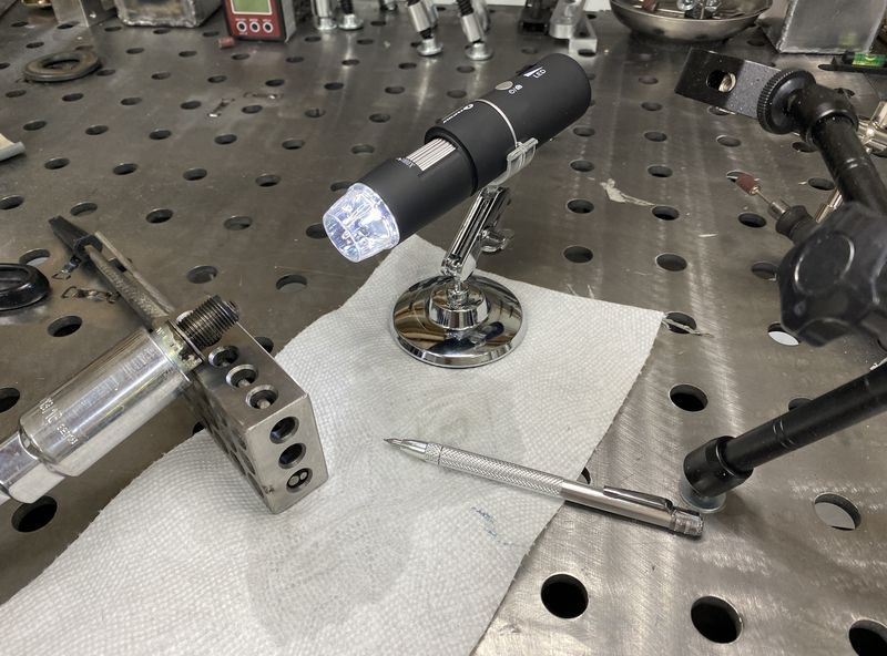 $30 electronic microscope.  I'm pretty sure I can view all the way down into the base of the plug with this thing - its remarkable.