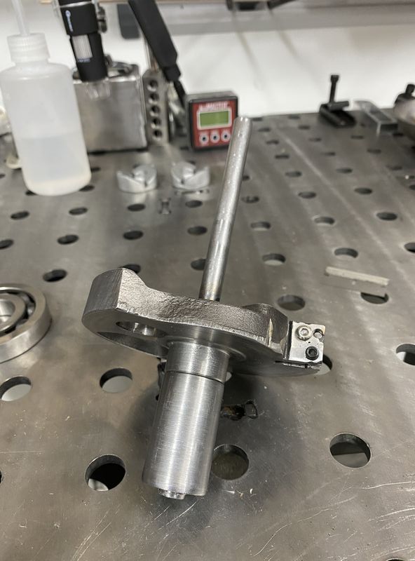 Cut it and "pressed" (read: hammered) it on to the crank half so that I could have an elongated section to slide in and out of the bearing to allow plunge cut as per Voodoo.