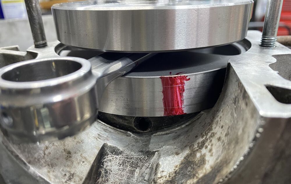 There is a lot of meat that can be taken out of a stock inlet once a P200 wide webbed crank is pulled in.  ~3.5MM per side.  Fine lines scratched in red are edges of existing inlet on this case.