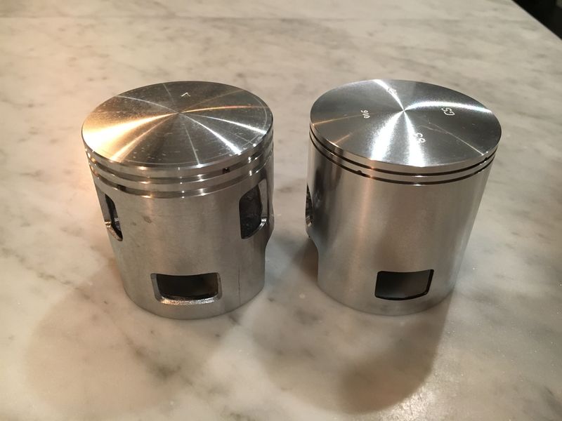 GS on right - lacks the two holes a'la O tuned piston and edges on existing hole are sharp.  Almost like they expect you to cut more holes.