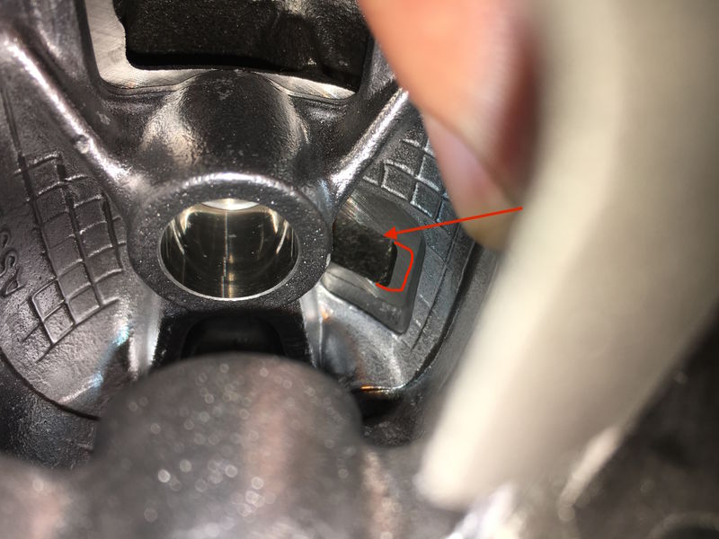 With piston about 1/3 the way down from "virtual TDC", these holes in the side of piston align with transfer ports in cyl (is there advantage to widen transfers here where red ] is?)
