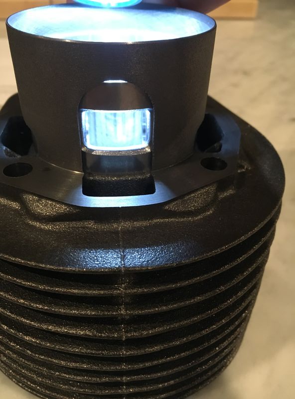 Front port with piston at same theoretical 120 position.  Does one open up this hole taller in either direction or is it better to keep as is.
