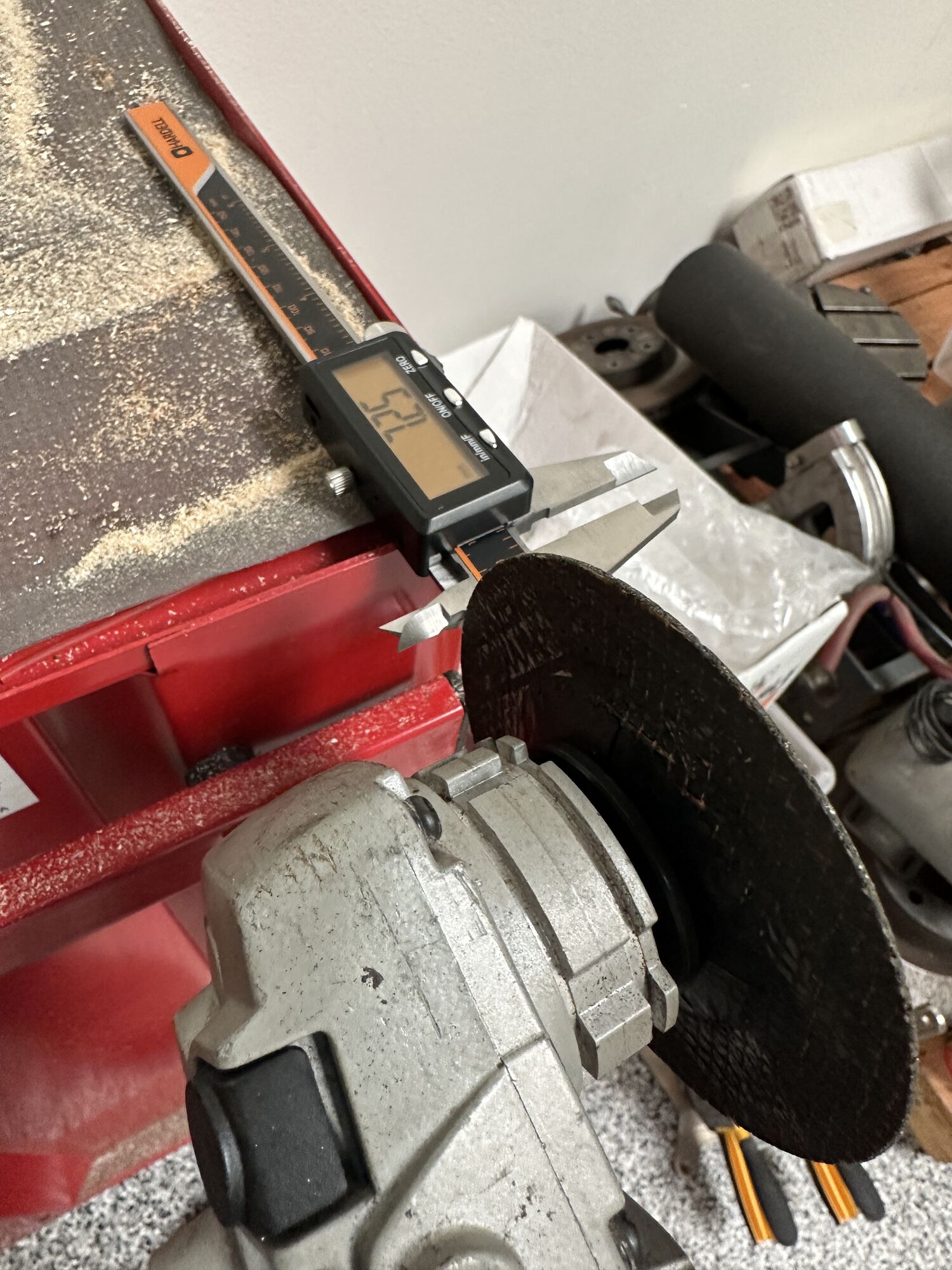 Took the angle grinder to the calipers to "adjust" their shape for use in the cylinder.  Tails had to go.