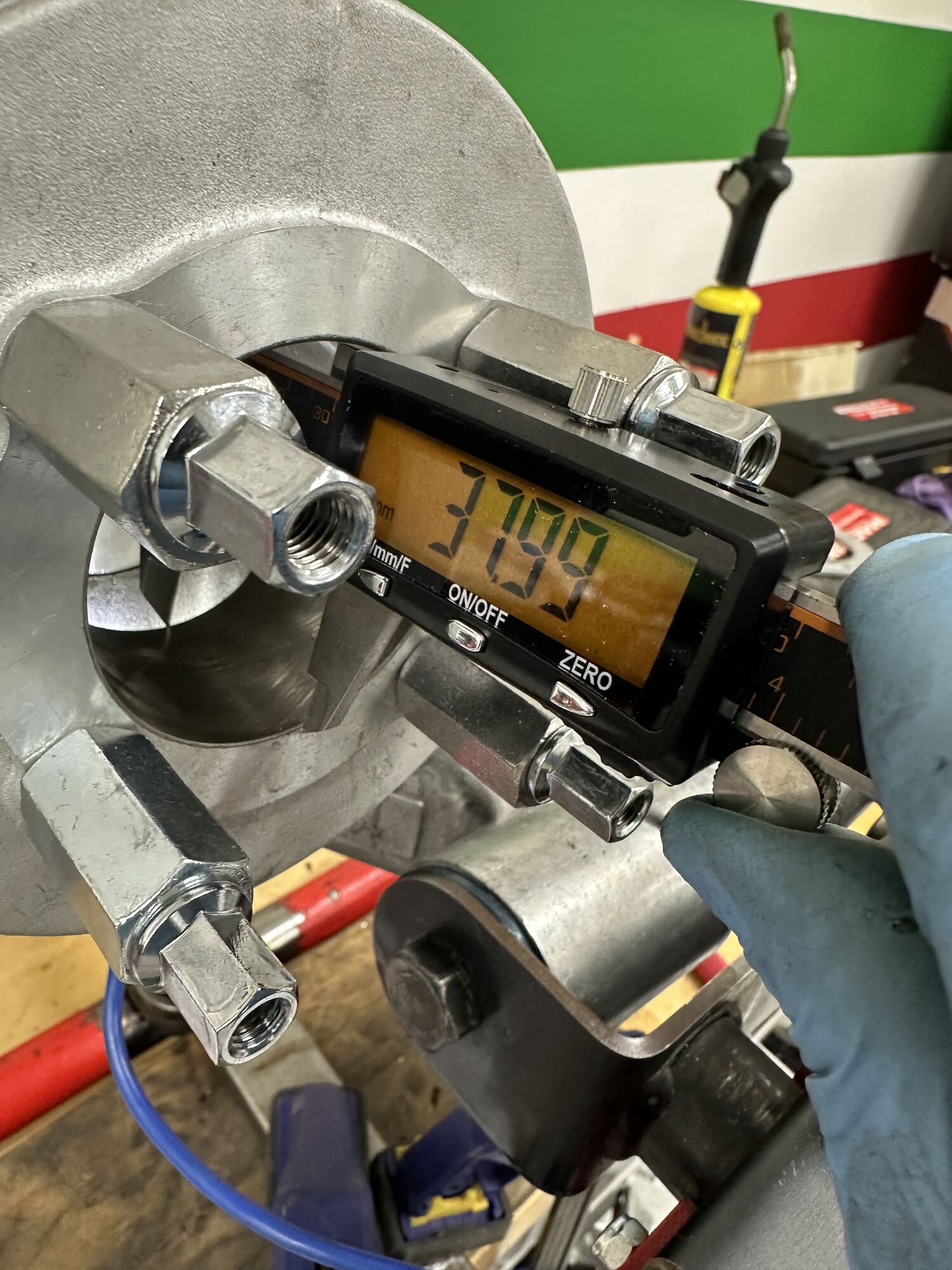 And here I am taking that measure with my calipers.  It's tough to be perfect/ repeat.  **Also assumes my piston TDC is at the top of the cylinder (which it seams to be), I prefer the camera and buzzwangle or wheel/pointer.