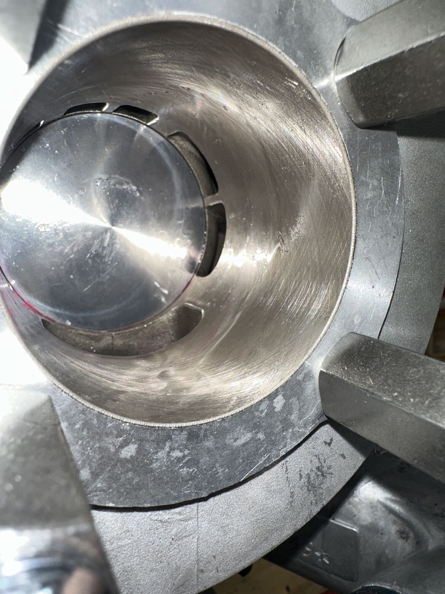 I'd say piston crown is ~1mm below bottom of transfer. Maybe 1.5mm max.