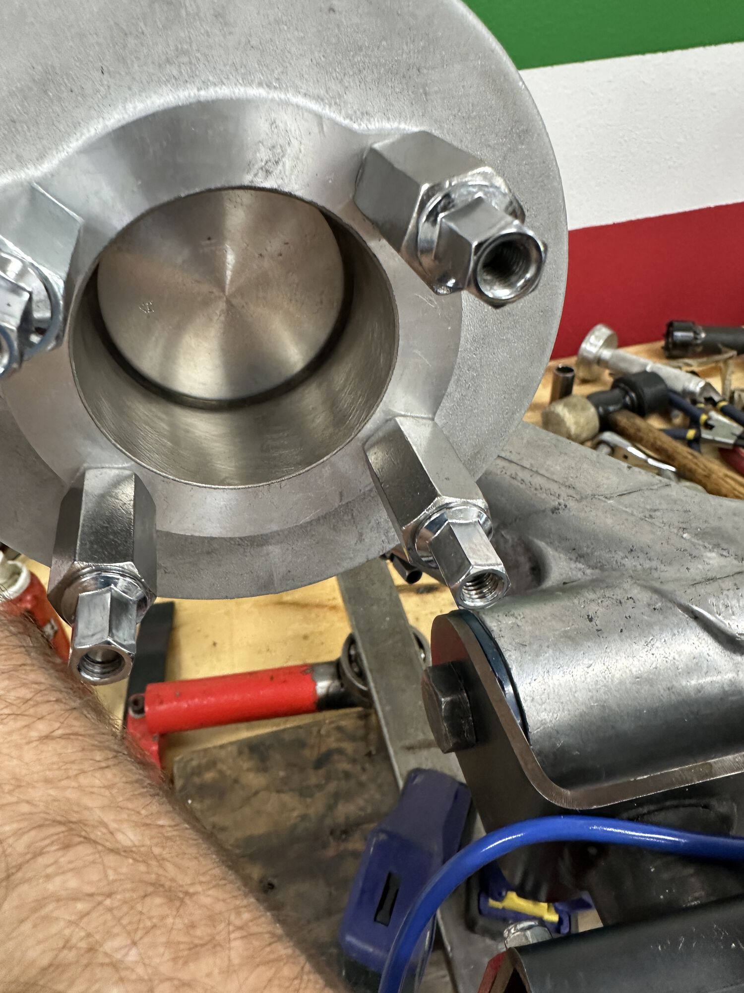 First I set an old ring inside the cylinder and pushed it up against the top of the piston.