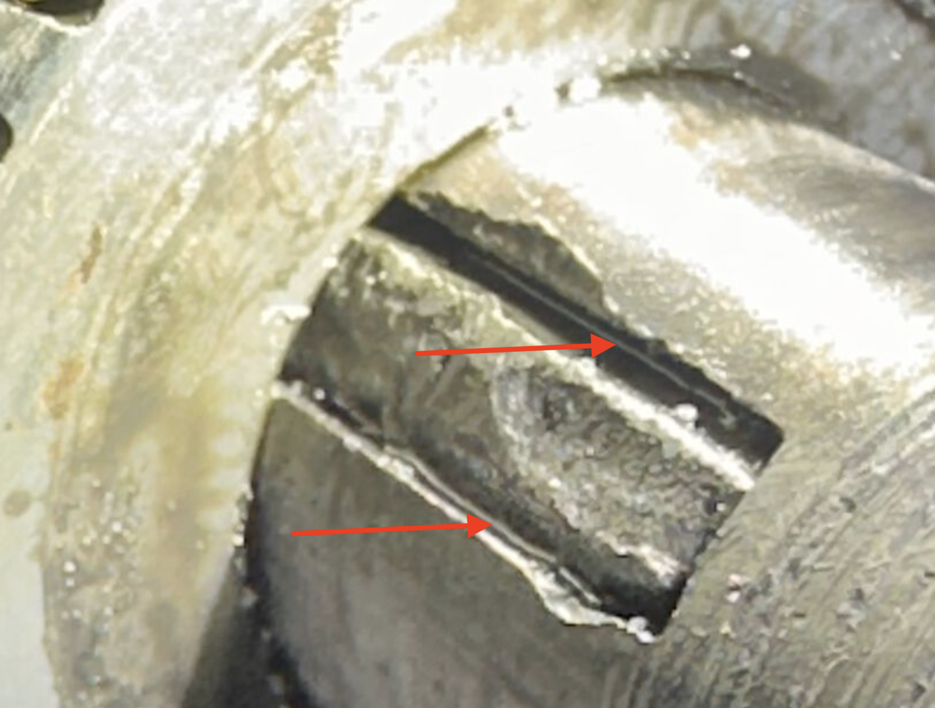 That sure looks like a shim to me.  if the slot can be dressed with a little file and honing stone, I'd assemble it and ride it.