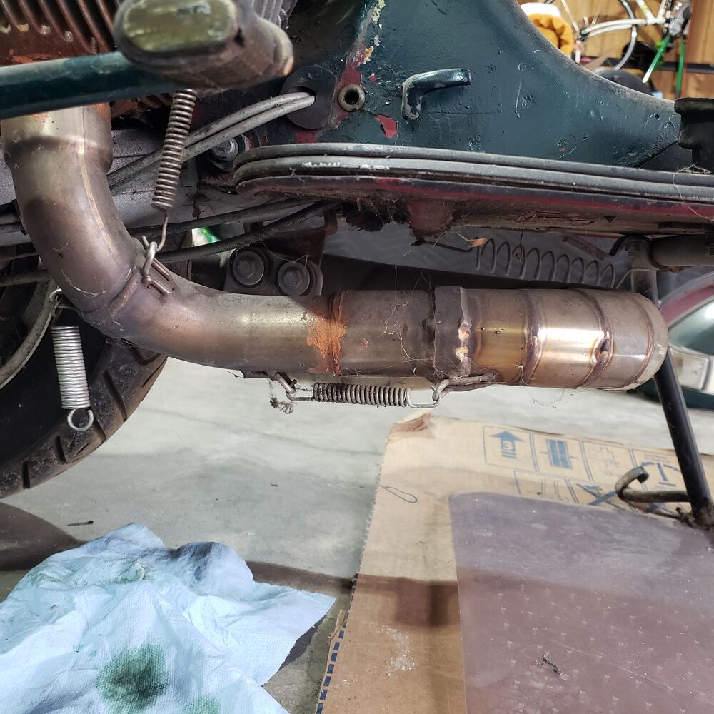 Exhaust has no markings at all but is very well made.  I'm a mechanical engineer and the welds and fabrication is top notch.  The pipe is stainless steel except the expansion sections that are magnetic but have no rust so may be a special steel.