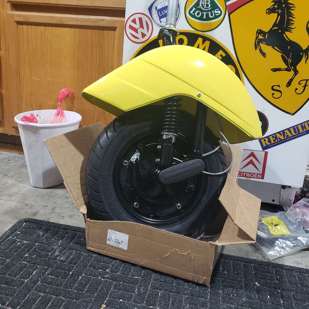 Front end done.  Putting the tire in a box stops it from rolling.  Really helpful if you are doing this on your own.